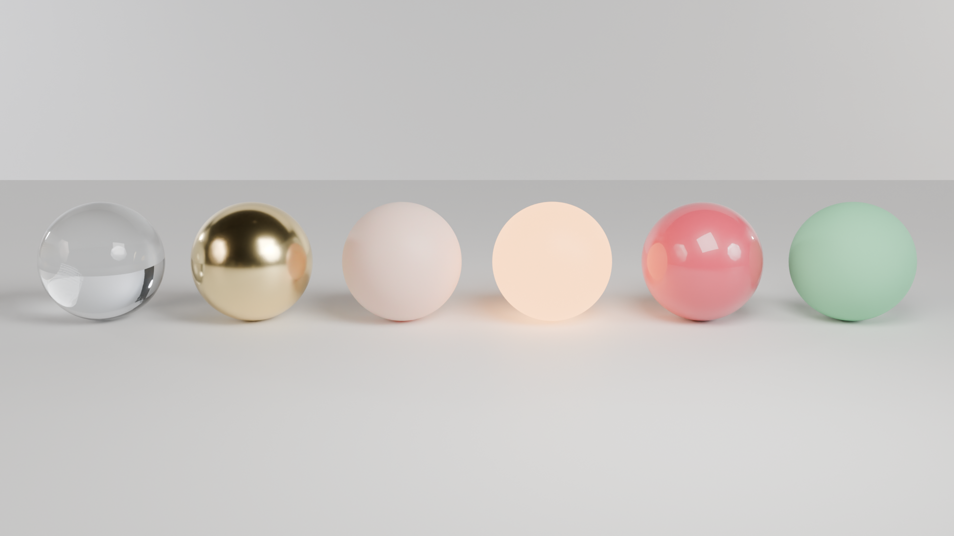 Six material balls: glass, gold, skin, emission, car paint, plastic